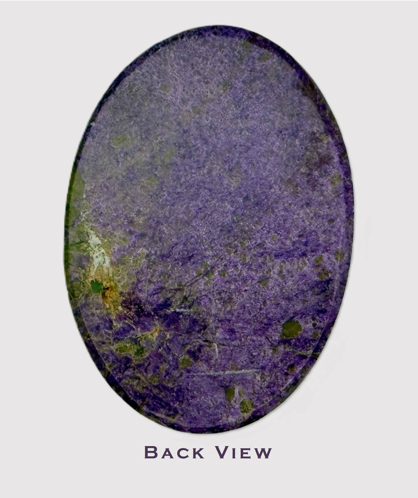 Vibrant purple Stichtite in green Serpentine cabochon - back view