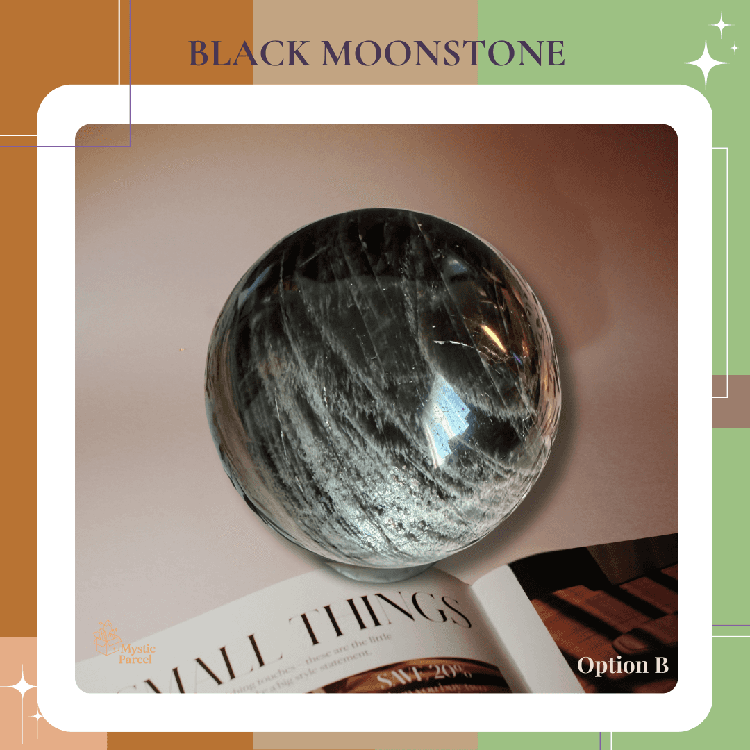 Black Moonstone Sphere displayed on open book background