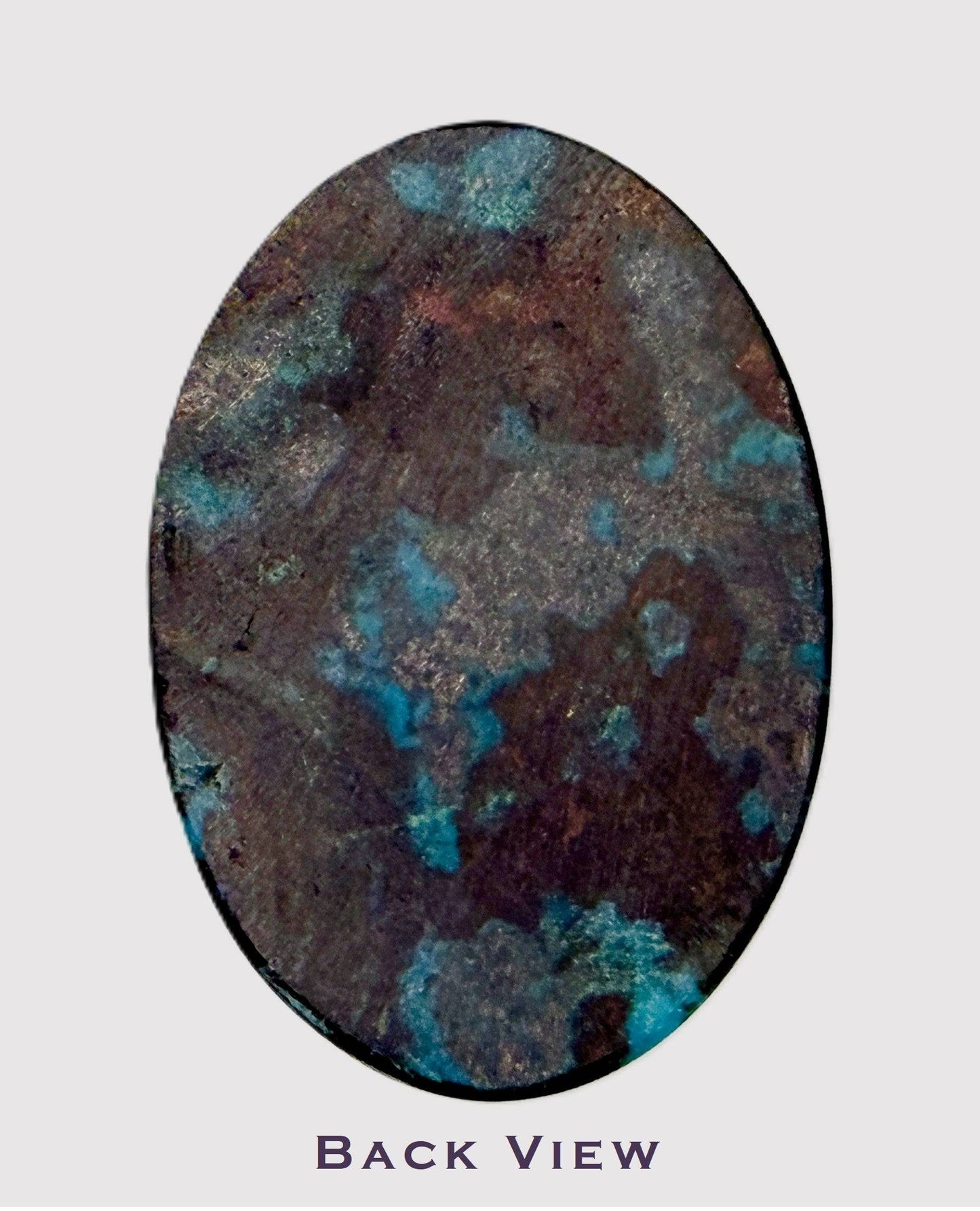 Oval-shaped chrysocolla cabochon with blue and brown patterns on a light gray background