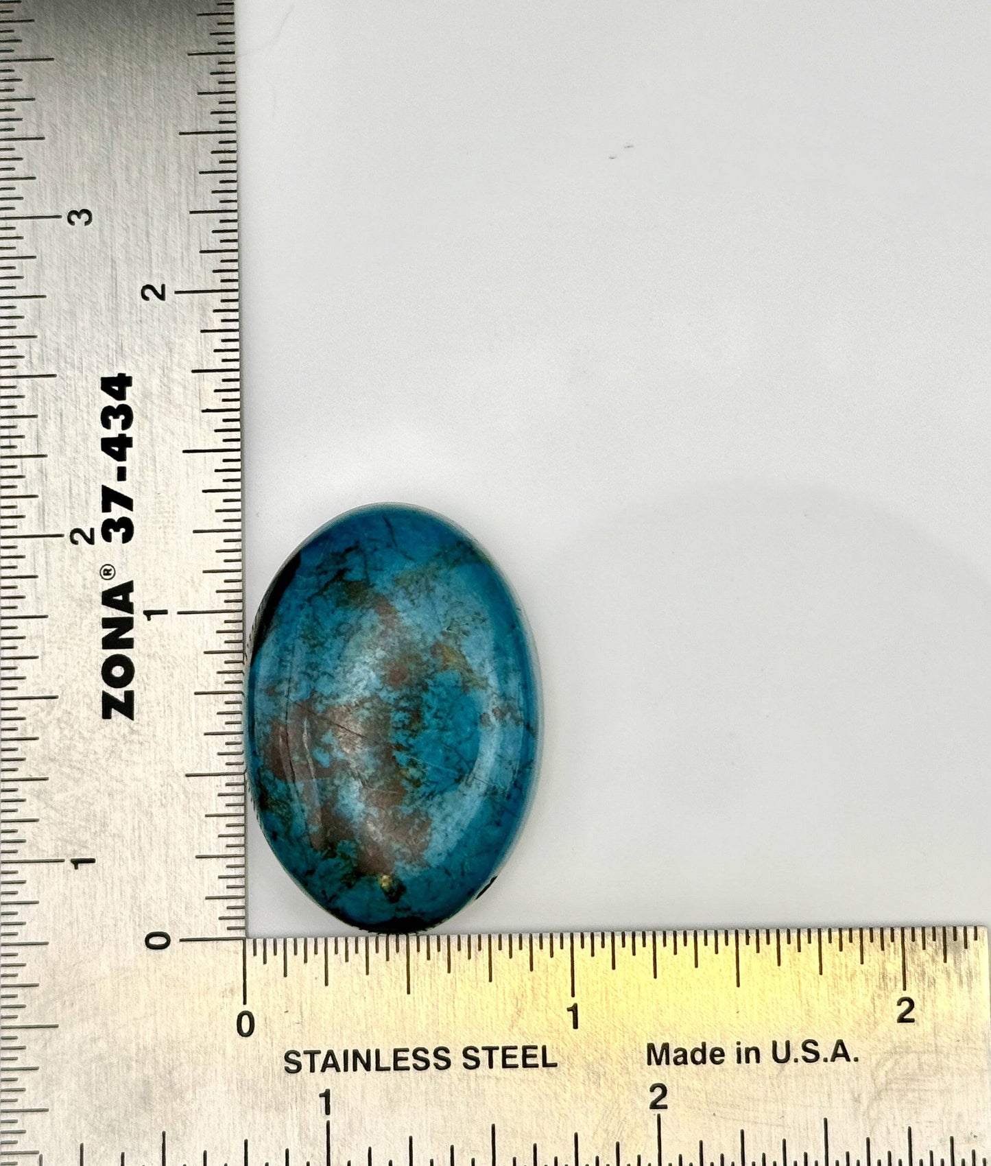 Blue-green Chrysocolla cabochon with natural matrix patterns measured 1 3/8"x7/8"