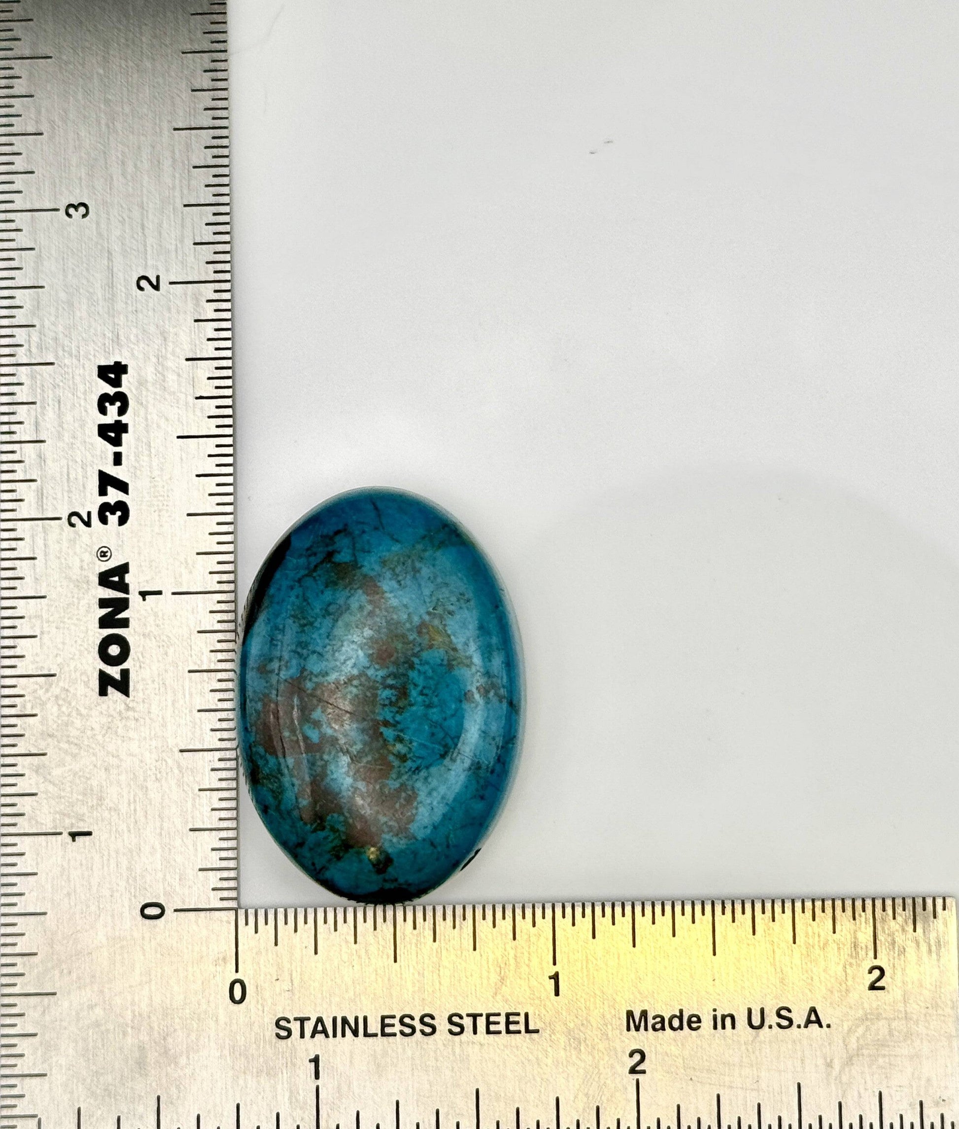 Blue-green Chrysocolla cabochon with natural matrix patterns measured 1 3/8"x7/8"