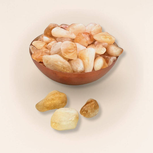 Bowl filled with Citrine Tumbled Stones from Brazil, perfect for gemstone collectors and energy work focused on joy and abundance.