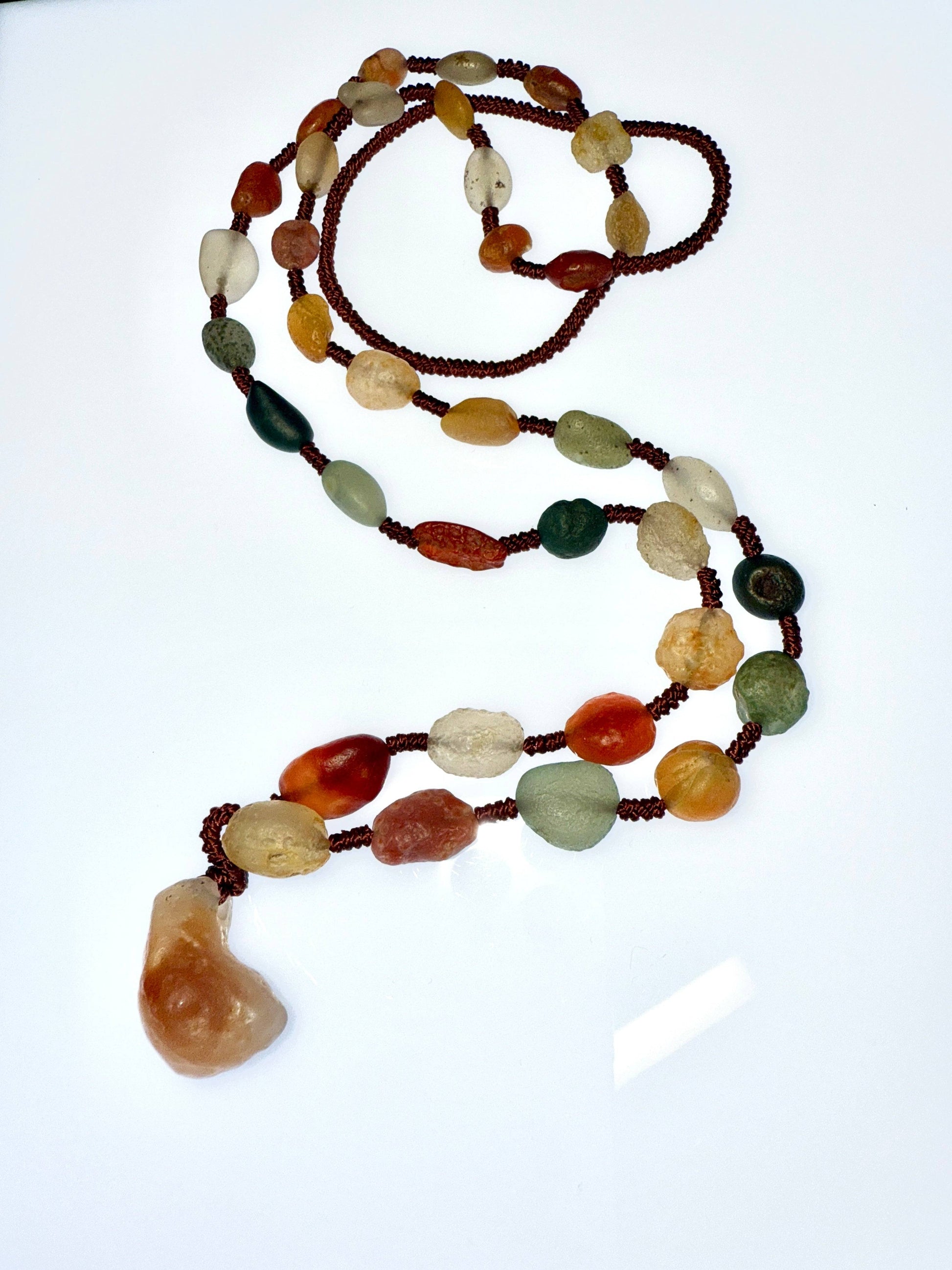 Detail of hand-knotted bead spacing on natural Gobi Desert Agate mala necklace
