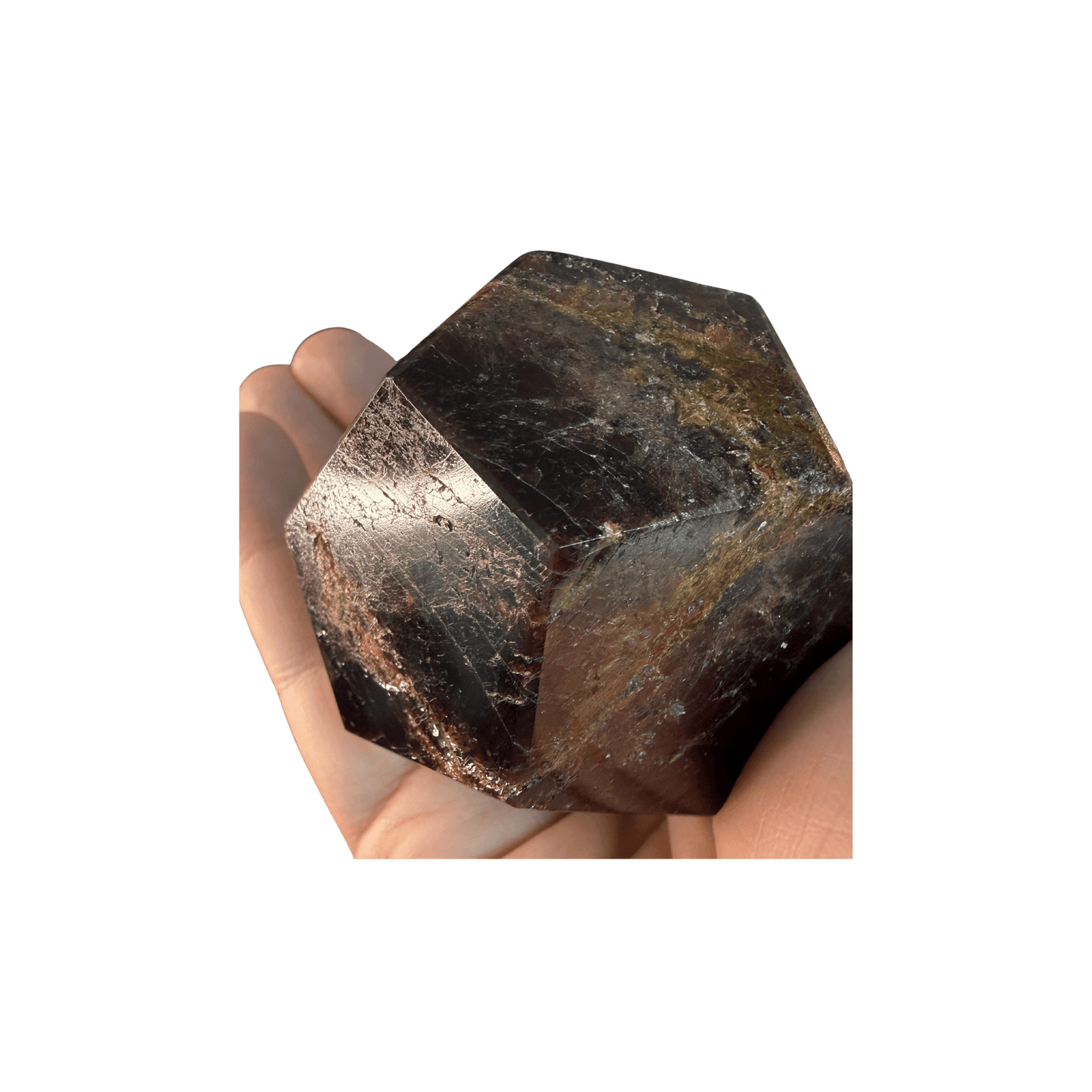 Hand holding a polished Garnet Dodecahedron Crystal for Grounding & Vitality, showcasing deep red hues and natural inclusions.