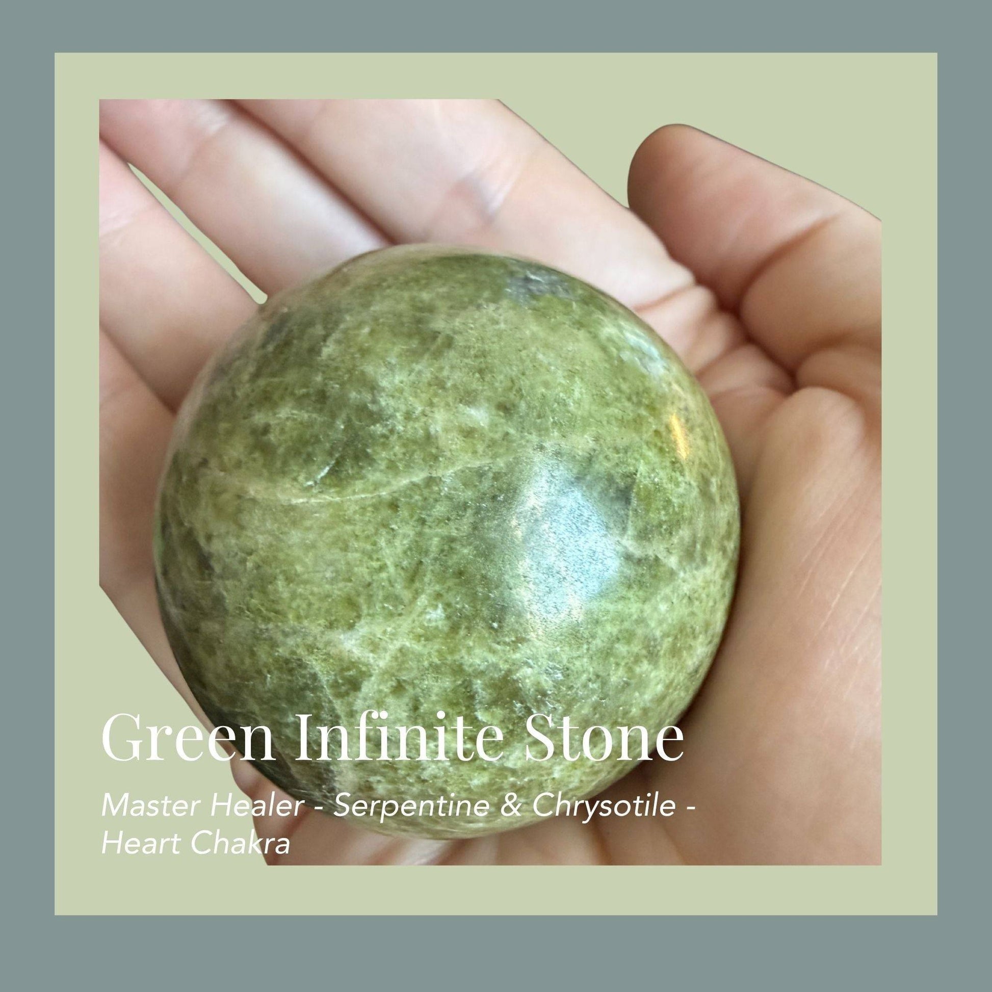 Infinite Stone sphere from South Africa pictured in a palm—green veining, polish shine, Heart-chakra healing stone.