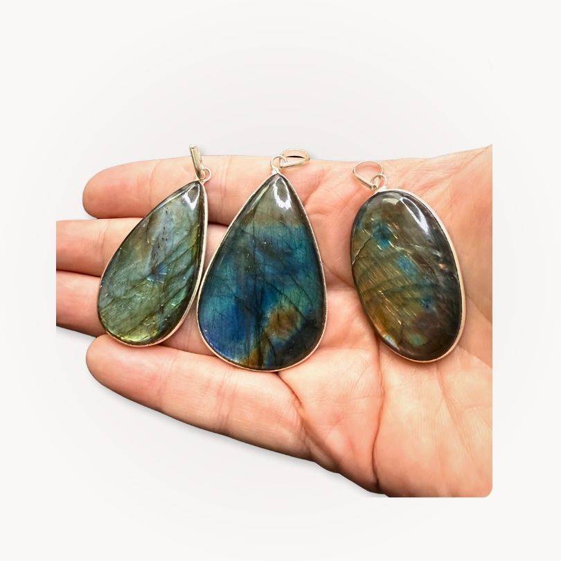 Set of three Labradorite Statement Pendants with unique blue-green flashes, perfect for intuition and protection in gemstone jewelry.