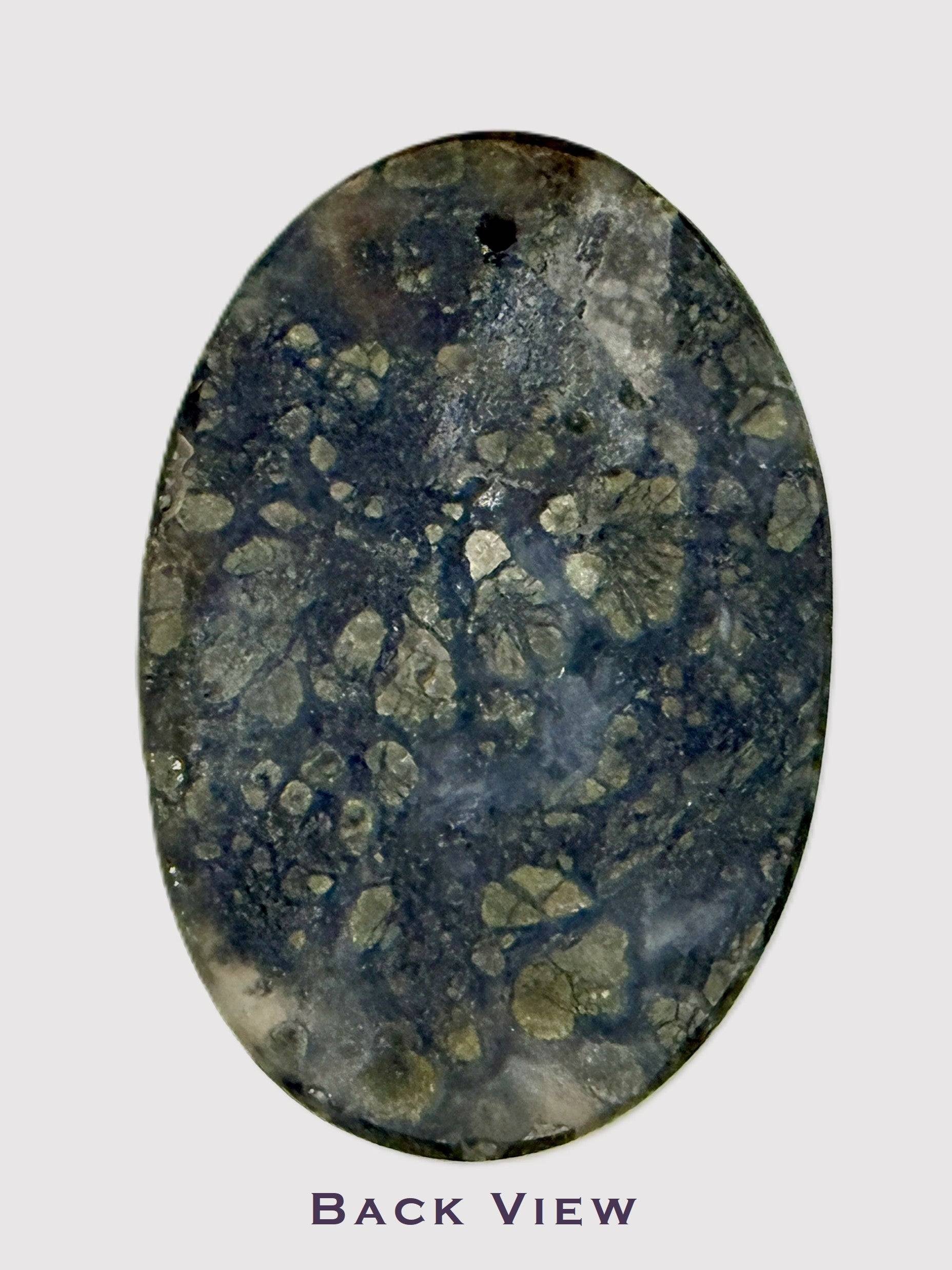 Sparkling pyrite inclusions in polished Marcasite cabochon - back view