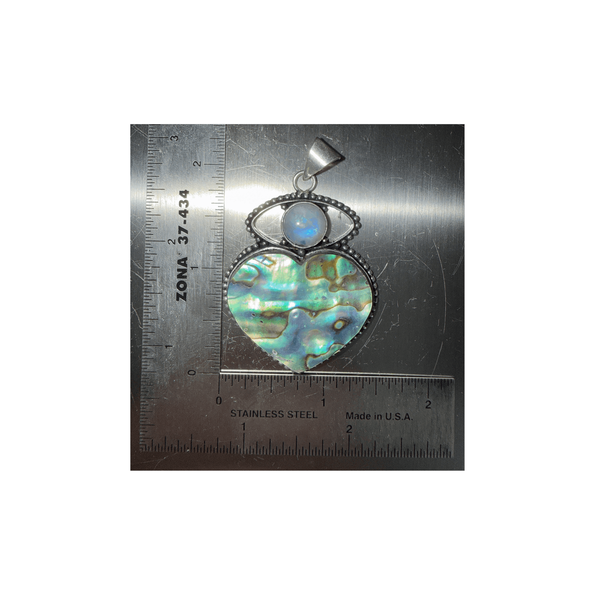 Rainbow Moonstone Evil Eye & Abalone Heart Pendant with sterling silver setting, featuring iridescent abalone shell and protective moonstone cabochon.