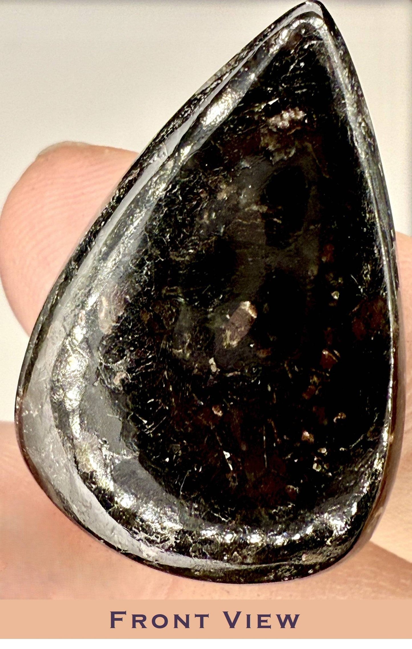 Nuummite tear drop cabochon 25ct with golden flakes
