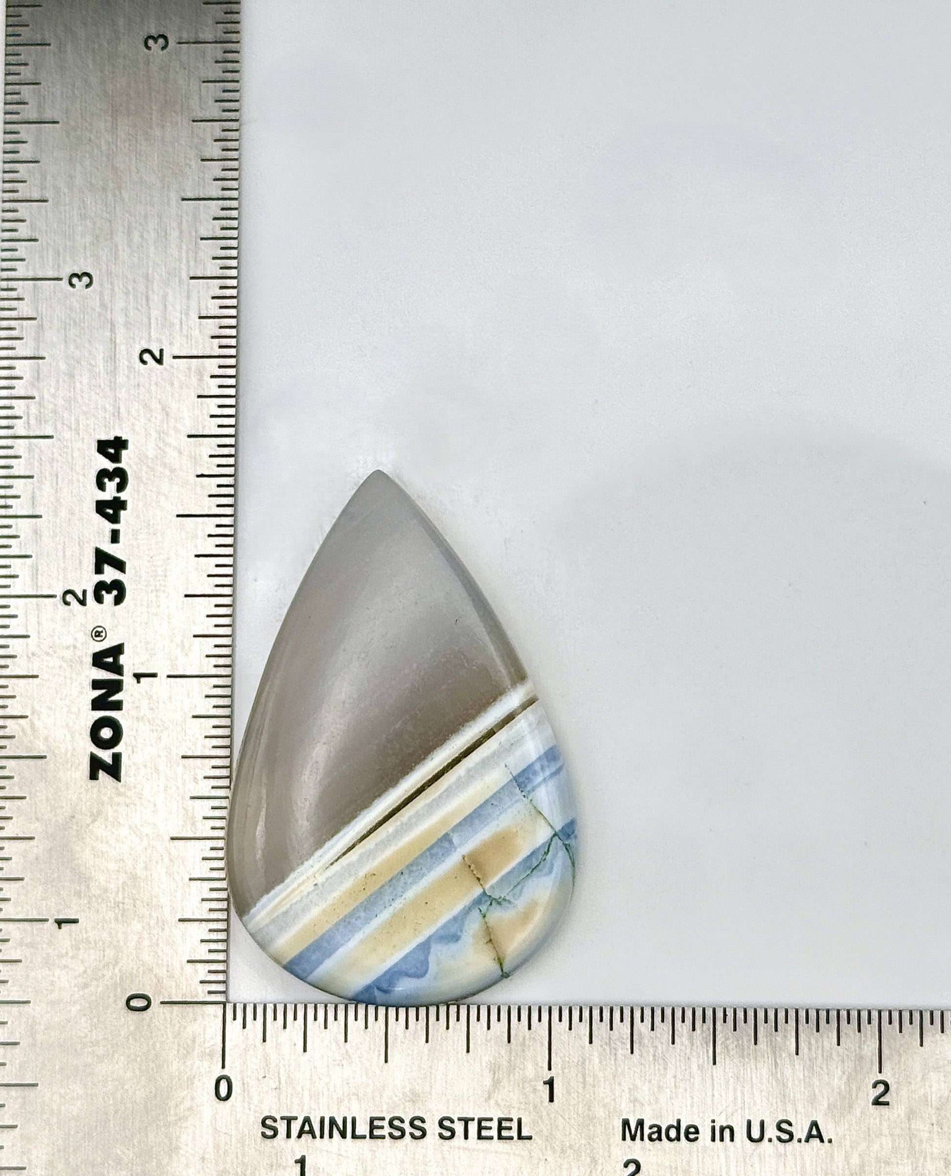 Polished 45ct Owyhee Agate cabochon with natural banding