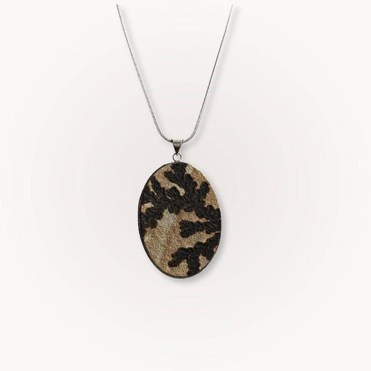 Large Psilomelane Jasper pendant with dendritic patterns on a silver chain. Unique grounding stone for jewelry lovers and spiritual wearers.