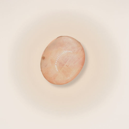 Set of peach moonstone palm stones showing natural colour variation