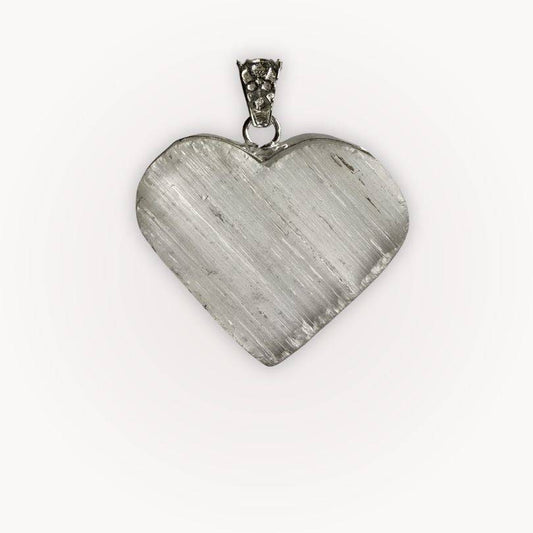 Close-up of Selenite heart pendant from Bond of the Heart aligned pairing, showcasing its radiant texture and silver bail.