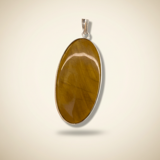 Tigers Eye Oval Pendant in sterling silver setting, offering courage, clarity, and protection for grounding and focus in daily wear. Front View.