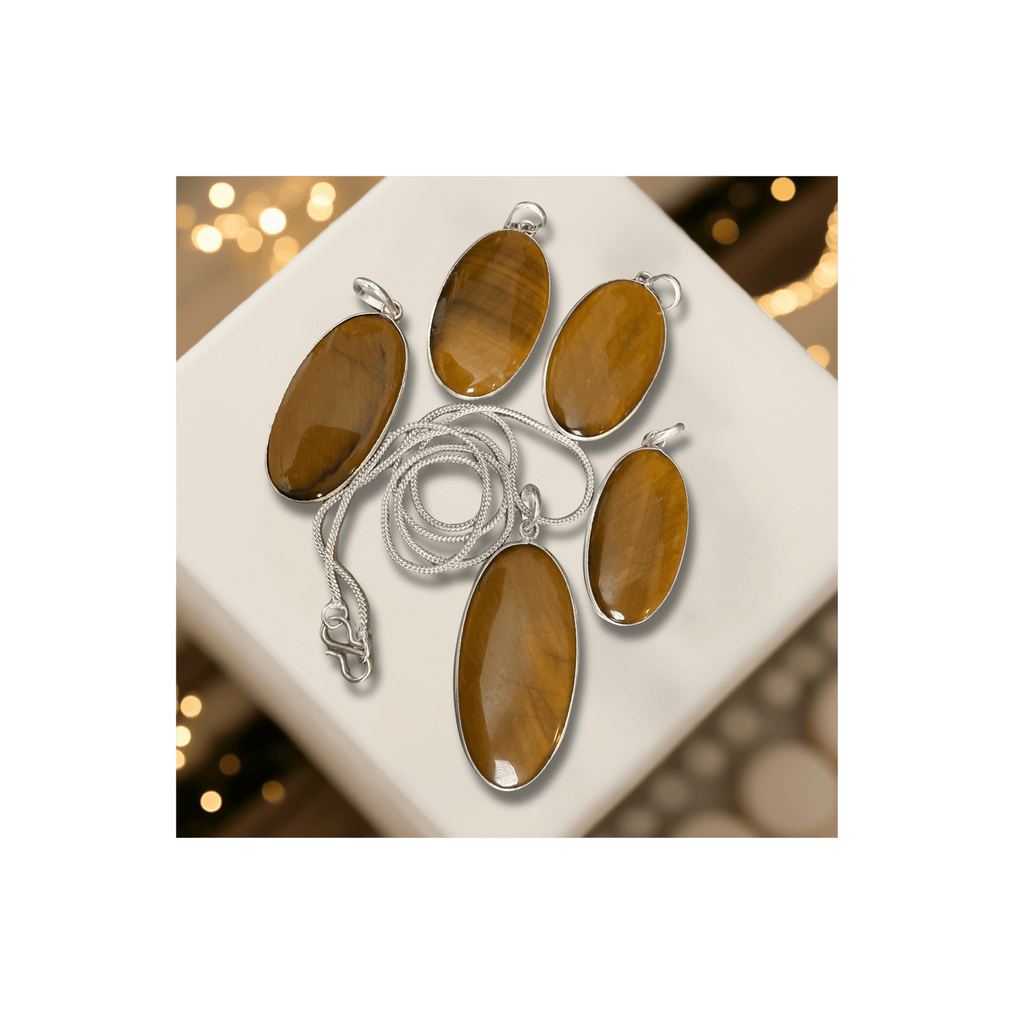 Tigers Eye Oval Pendant in sterling silver with polished brown-gold hues, symbolizing courage, clarity, and protection. Ideal for grounding and focus.