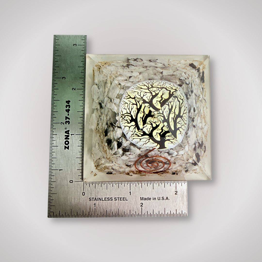 Tourmalinated Quartz Orgonite Pyramid measured with rulers, highlighting its compact size and intricate Tree of Life design for decor use.