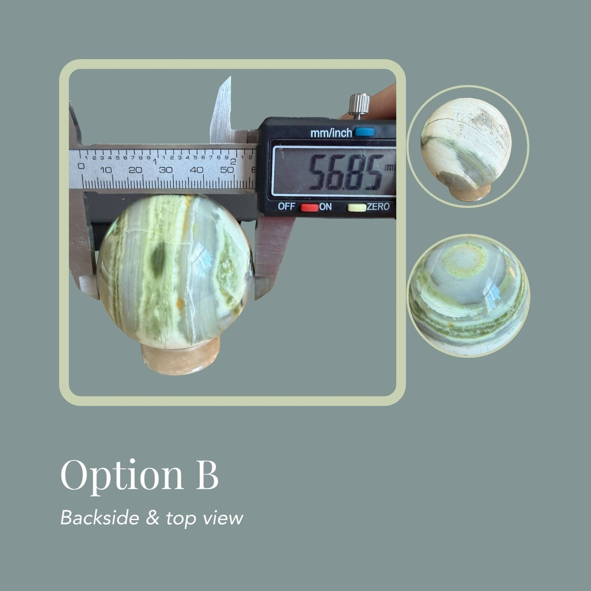 Infinite Stone sphere Option B—striped greens with pale veining, multi view. View of sphere with caliper showing 56.85 mm diameter.