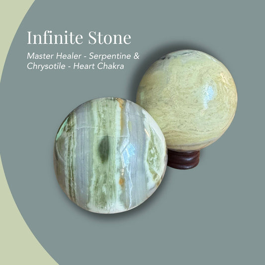 Yellow Infinite Stone sphere from Peru on minimalist backdrop—yellow, green, gray, white, and cream veining, polish shine, Heart-chakra healing stone.