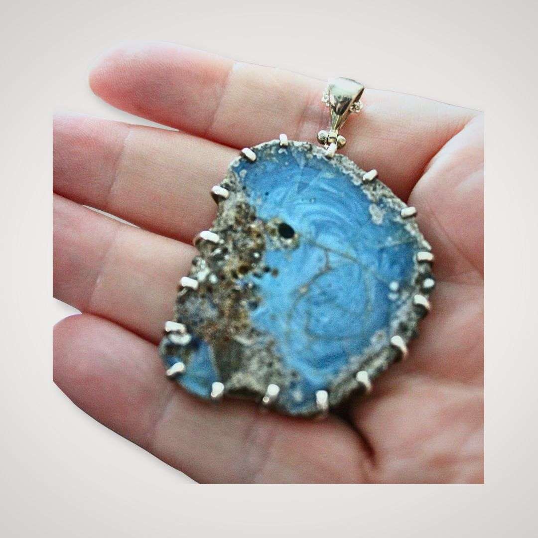 Swedish slag glass pendant with vortex pattern in sterling silver setting