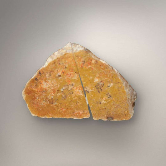 Natural polyhedral agate nodule showing warm outer rind and angular geometry