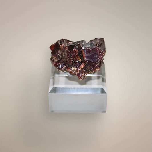 Reverse view of Moroccan Vanadinite cluster showing deep red-brown intergrown crystal faces