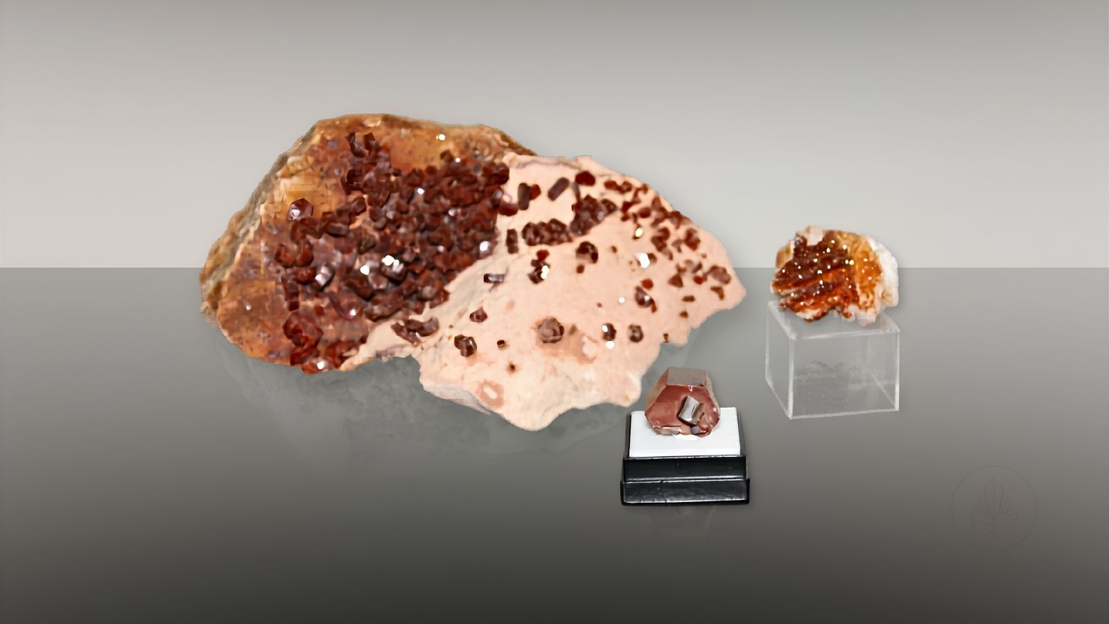 Vanadinite crystal specimens in varying sizes, illustrating how quality is determined by formation, luster, color saturation, and crystal structure rather than size alone.