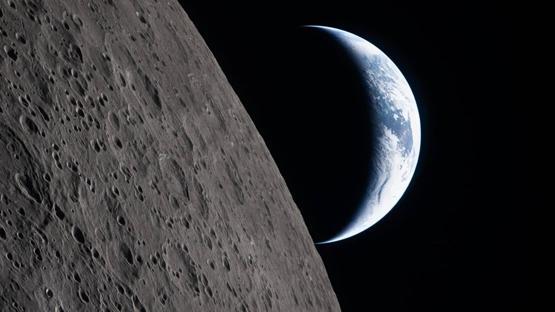 Artemis II image of the crescent earth over the moon horizon