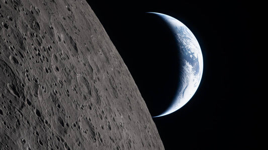 Artemis II image of the crescent earth over the moon horizon