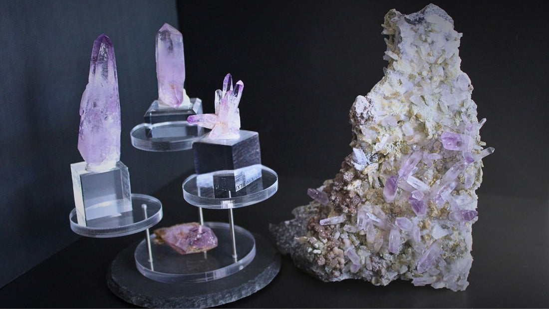 Veracruz amethyst crystals with pale violet terminations displayed beside a large amethyst cluster on matrix.