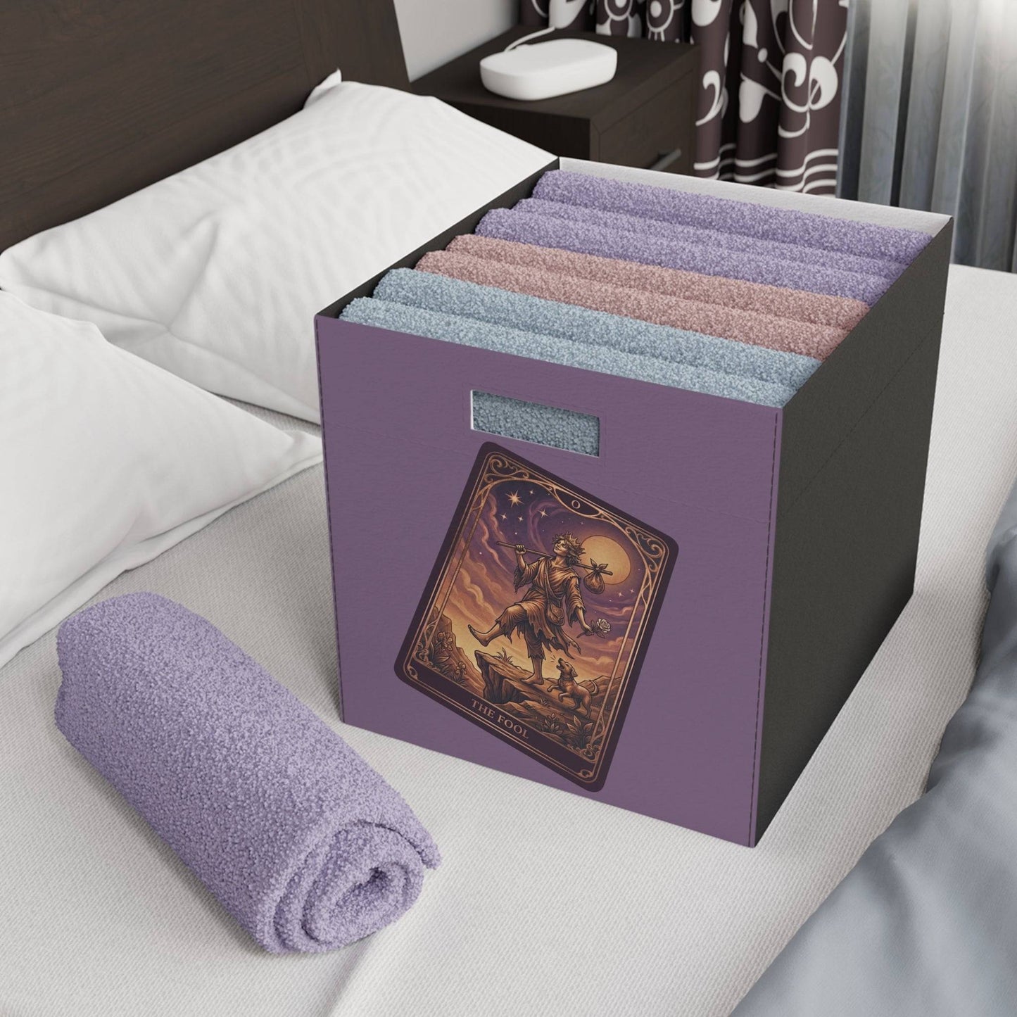 The Fool Tarot Storage Box holding rolled towels on bed