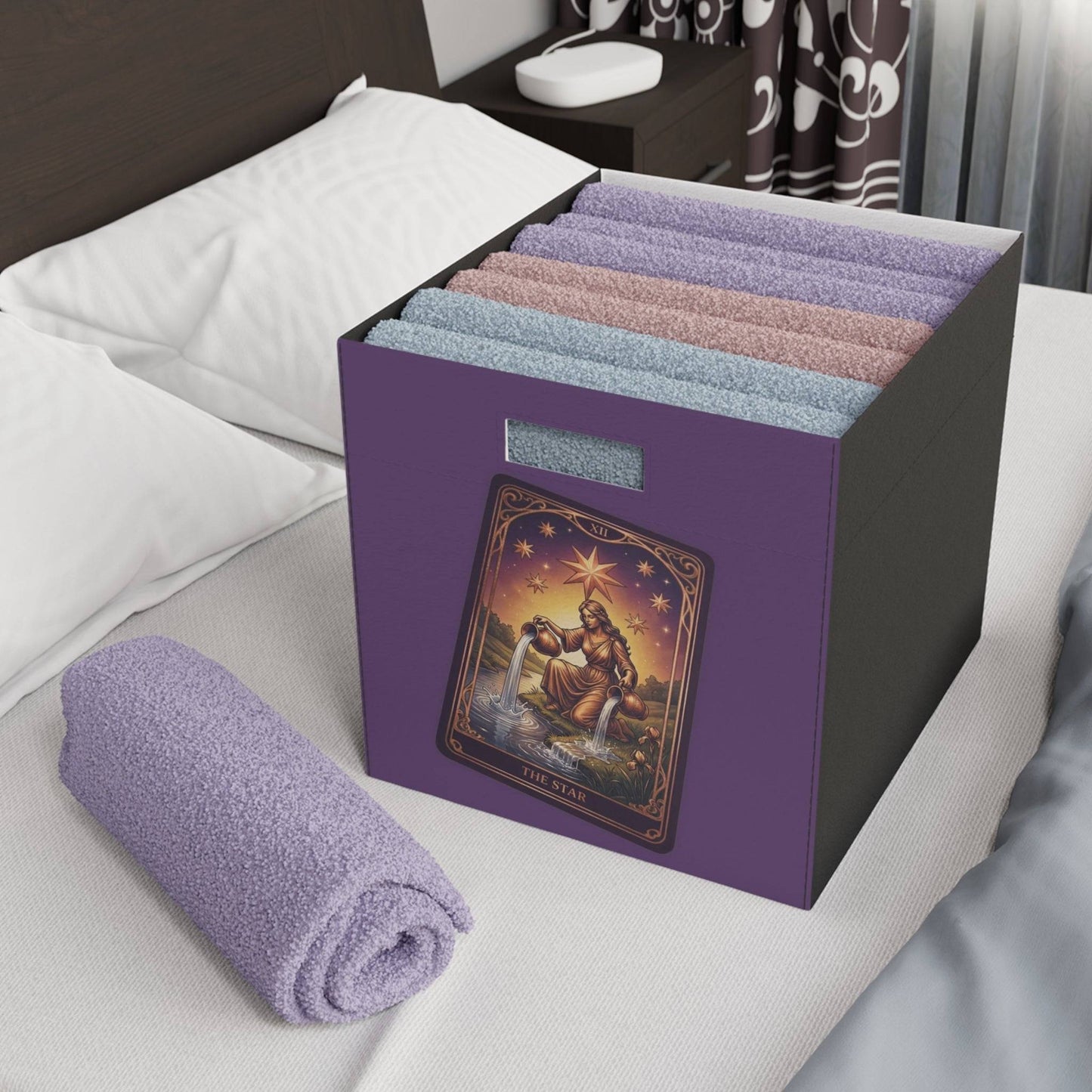 The Star Tarot felt storage box used for towel organization in a bedroom, blending mystic decor with practical home storage solutions.