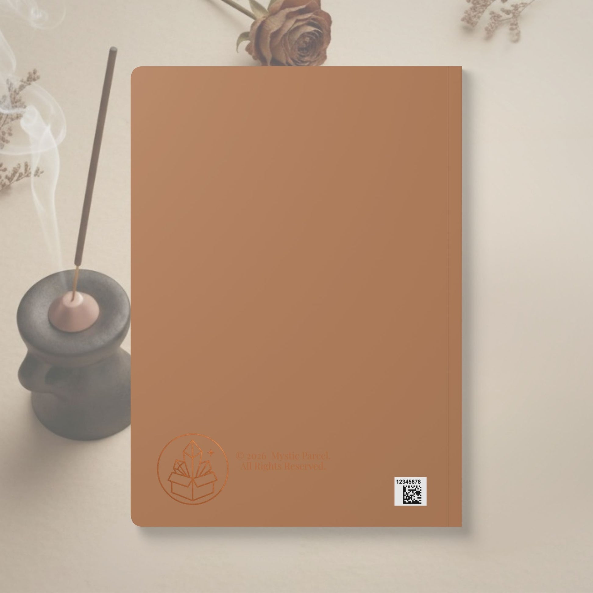 Brown notebook with a logo and text on a light background