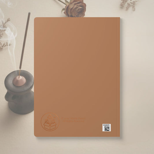 Brown notebook with a logo and text on a light background