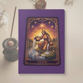 The Star Tarot Softcover Journal by Mystic Parcel features a vibrant tarot card illustration on a purple cover, ideal for journaling or note-taking.