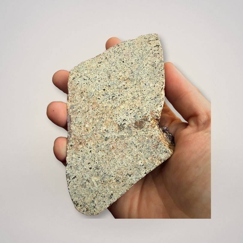 Back view of Alaçam Amethyst Collector Specimen — Deep Purple Cluster (227g) showing natural stone base held in hand for scale and texture detail.