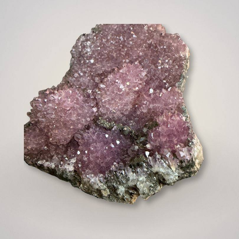 Close-up of Alaçam Amethyst Druzy Specimen — Multi-Peak Crystal Formation (94g) highlighting vivid purple hues and sparkling crystal surfaces.