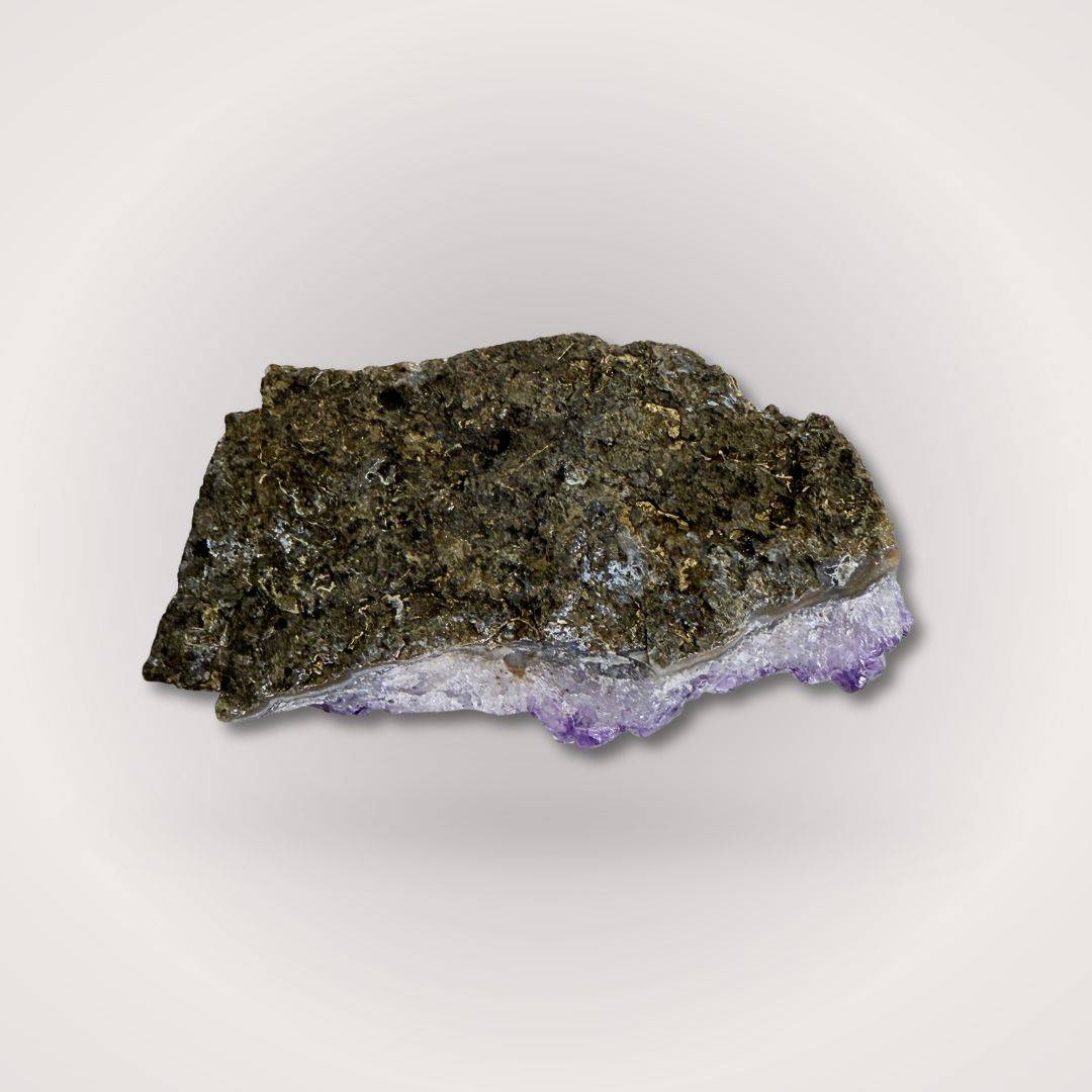Backside of Brazilian Amethyst Geode Cluster Piece 50–100g showing raw rock matrix, highlighting its natural origin and authenticity.