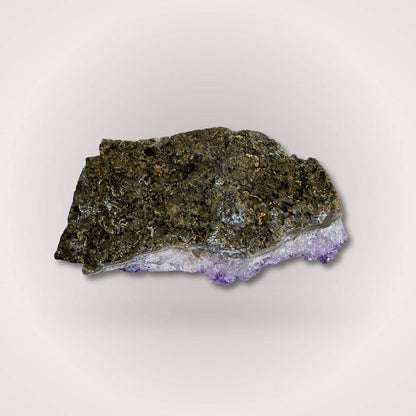 Backside of Brazilian Amethyst Geode Cluster Piece 50–100g showing raw rock matrix, highlighting its natural origin and authenticity.