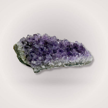 Amethyst Geode Cluster Piece 50–100g featuring rich violet crystal points, sourced from Brazil for clarity and intuitive alignment.