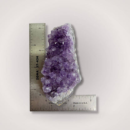 Brazilian Amethyst Geode Cluster Piece measured against a ruler, showing 50–100g size range for gemstone collectors and hobbyists.