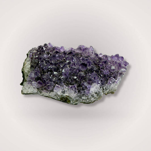 Brazilian Amethyst Geode Cluster Piece 50–100g with deep purple crystals and natural base, ideal for altars or gemstone collections.