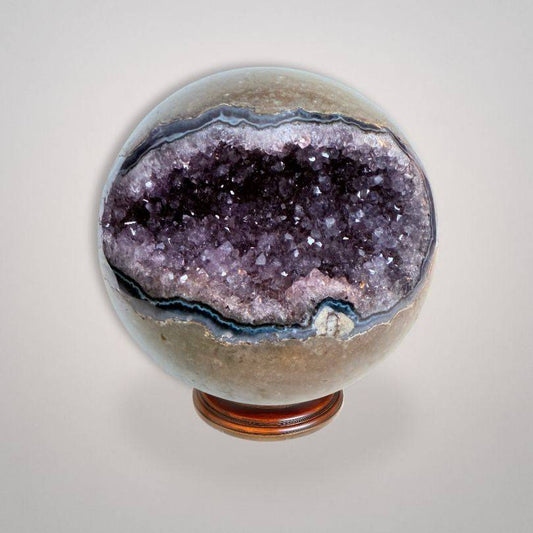 Amethyst Geode Sphere Brazil 761g with deep violet druzy crystals and polished exterior, ideal for spiritual clarity and home decor.