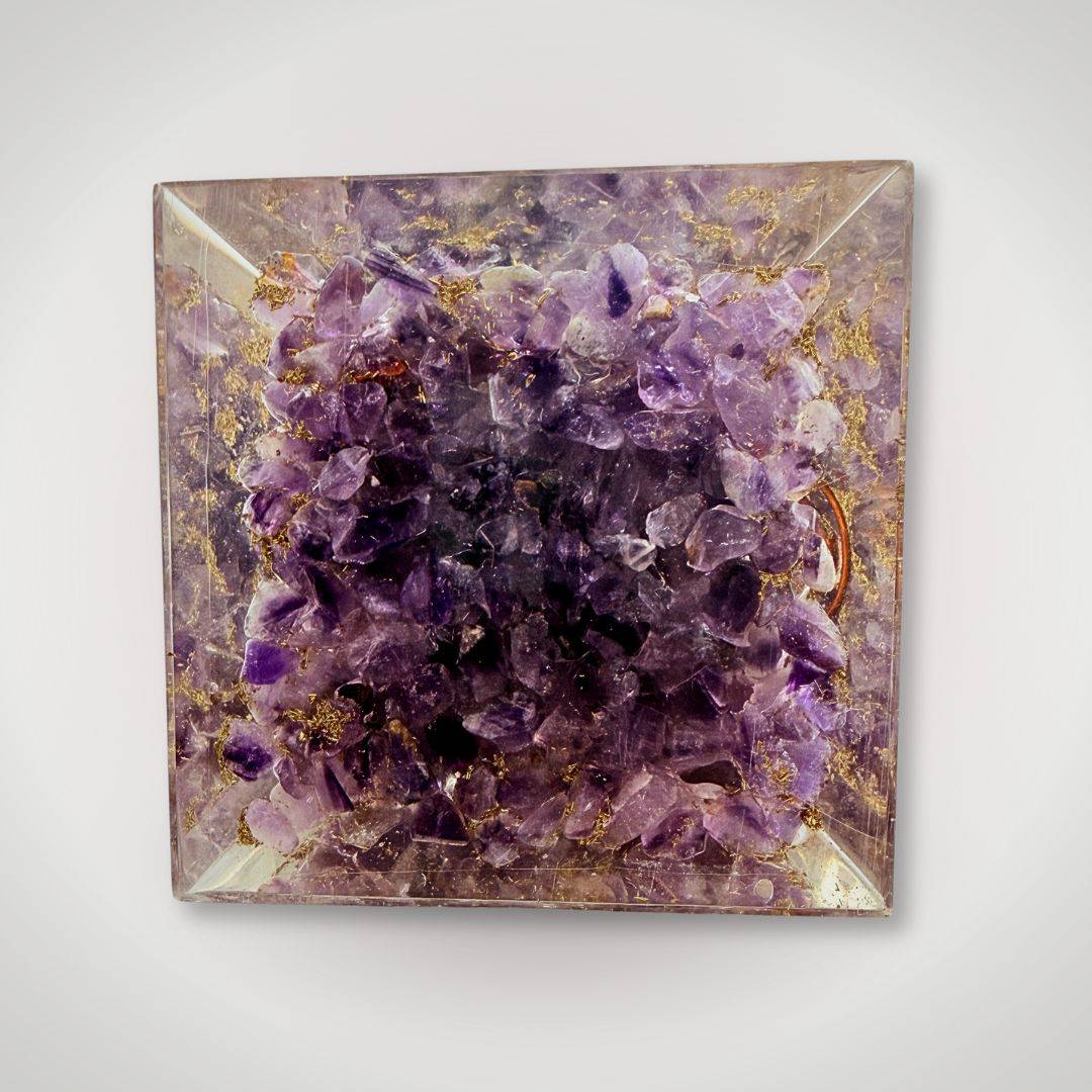 Bottom view of Amethyst Tree of Life Orgonite Pyramid showcasing dense amethyst crystals for spiritual balance and calming decor.