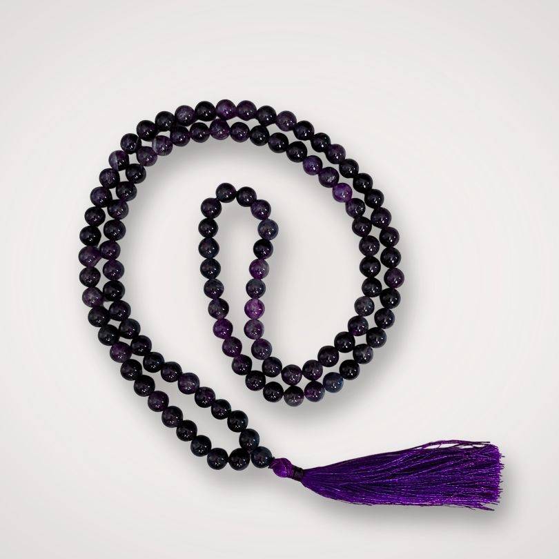 Amethyst Mala for calm meditation with 108 polished purple beads and a deep violet tassel, ideal for spiritual focus and mindfulness rituals.