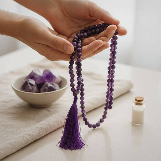 Hand holding Amethyst Mala for calm meditation, featuring 108 beads and tassel, perfect for intuitive clarity and prayer bead practices.