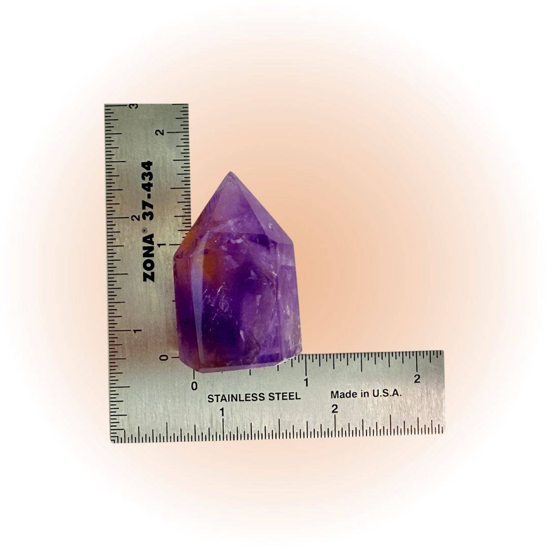 Natural Ametrine Amethyst Crystal Tower from Brazil with vibrant purple and golden hues, shown next to a ruler for size reference. Ideal for balance and clarity.