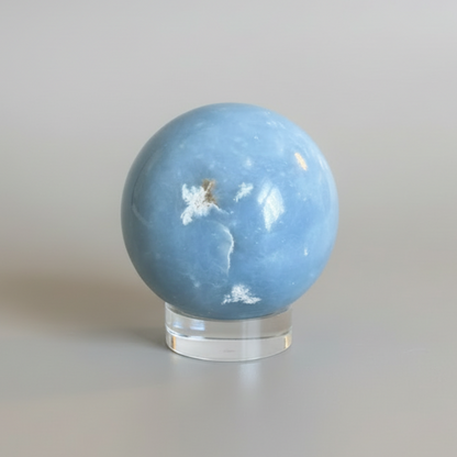 Angelite Sphere for Meditation - Calm & Soothing. Handcrafted sky-blue Angelite mineral sphere from Peru, ideal for spiritual connection and serenity.
