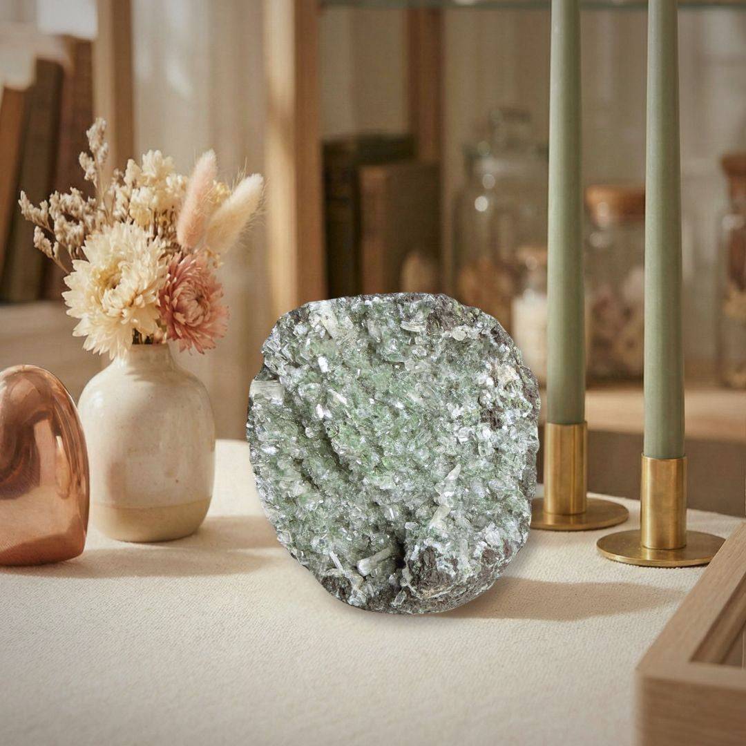Green Apophyllite Stilbite Specimen displayed on a tabletop in a cozy setting, perfect for home decor or crystal healing enthusiasts.