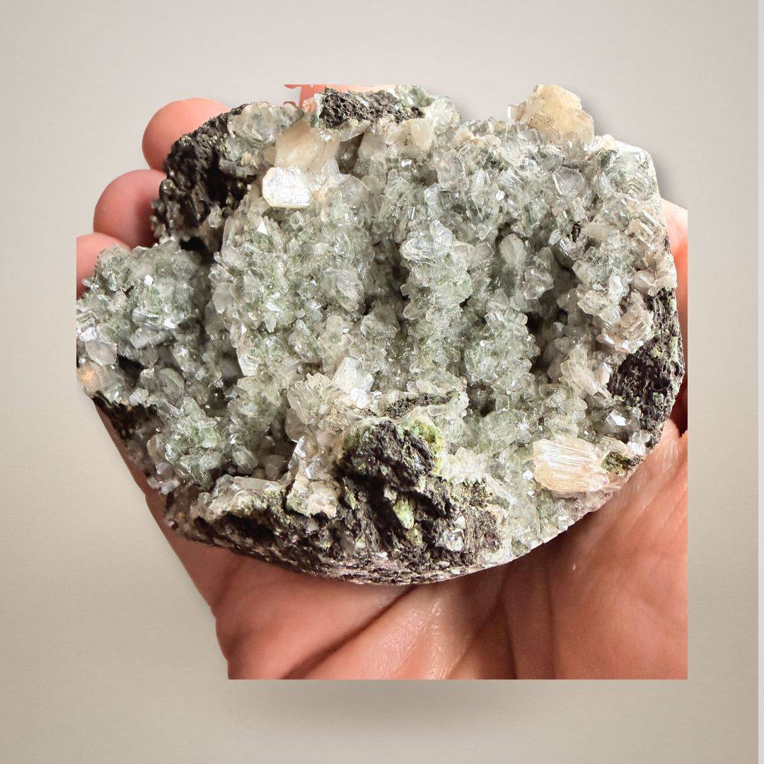 Handheld Green Apophyllite with Stilbite Geode Cluster - Sm Collector Specimen showing crystal clarity and intricate mineral formation.