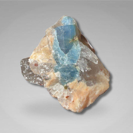 Brazil Gem Trio - Raw Aquamarine, Peach Moonstone & Pink Tourmaline specimen featuring a vibrant blue aquamarine crystal embedded in matrix. Ideal for gemstone collectors and crystal enthusiasts.